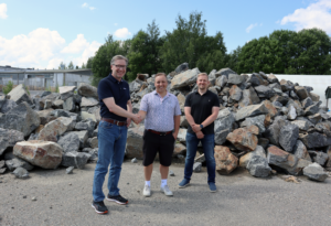 Heikki and Panu from Adwatec shaking hand with constructor of Adwatec new premises