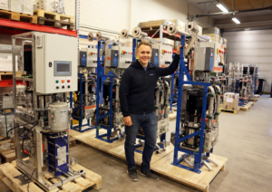 Technical Manager Teemu Alajoki in front of Adwatec water cooling station