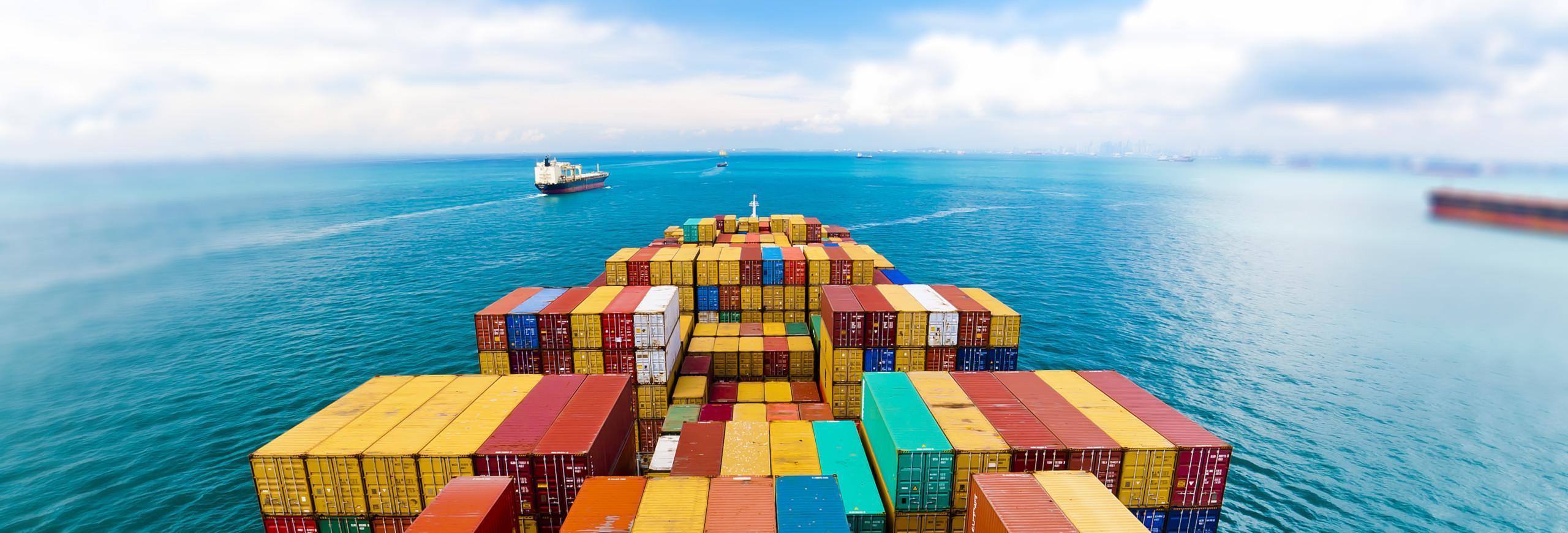 Close up of a cargo vessel dec with containers on it