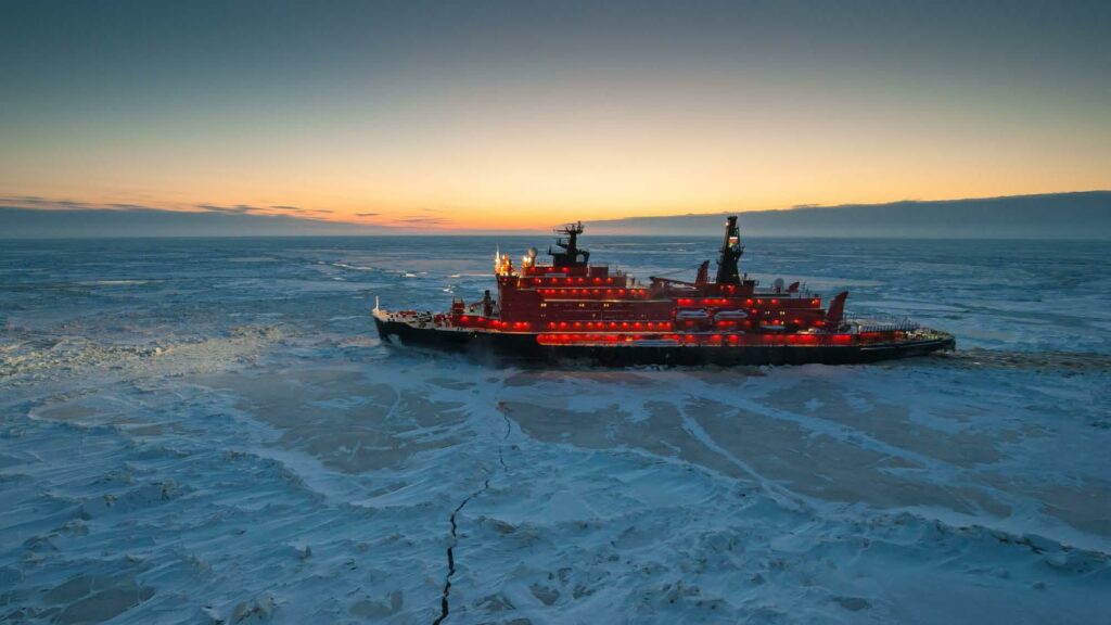 Red icebreaker doing it's job in the glacier