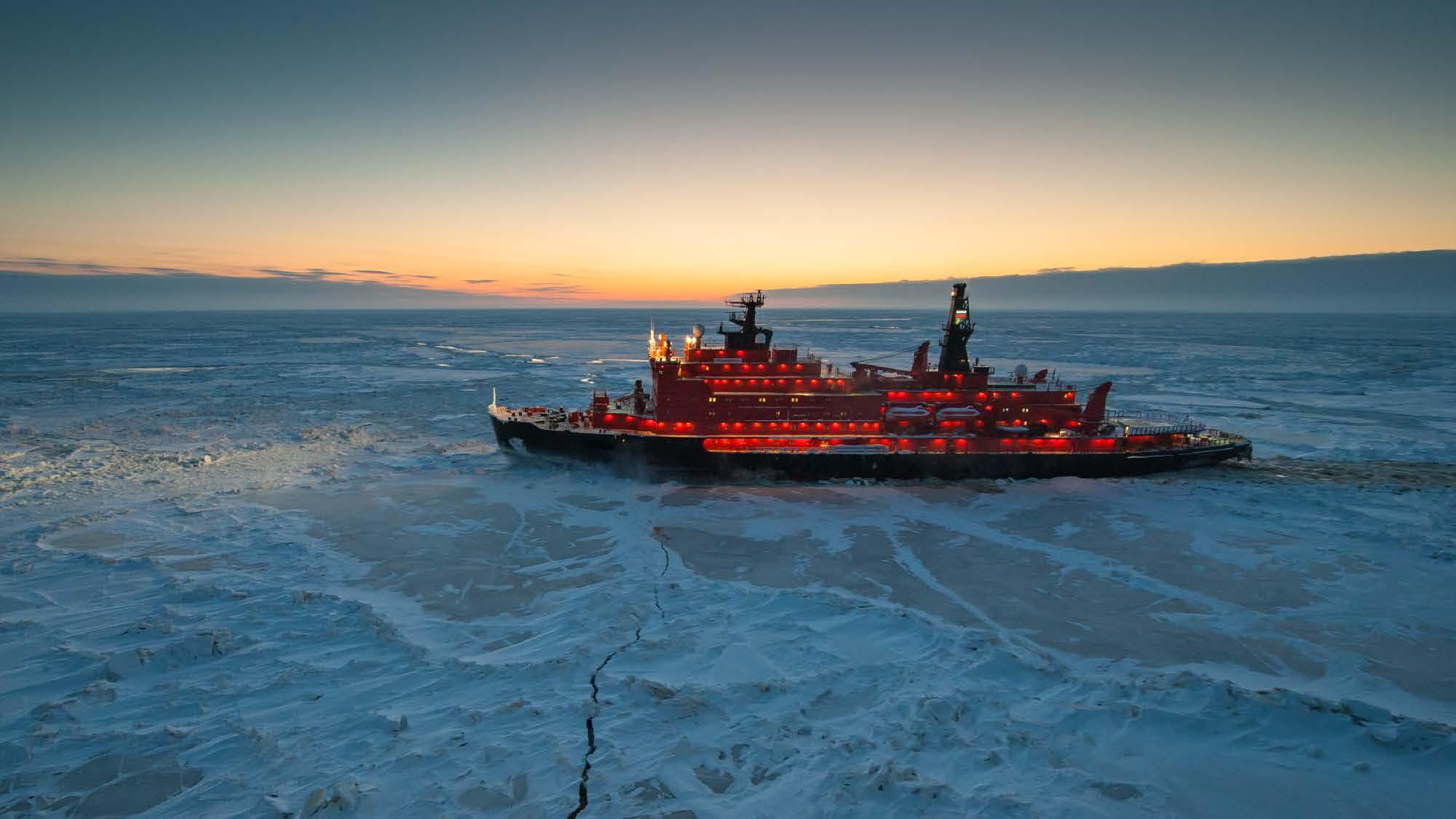 Red icebreaker doing it's job in the glacier