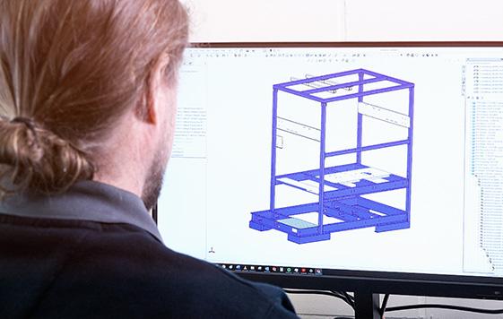 Adwatec worker in front of computer screen doing design work