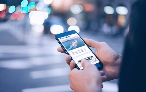 Closeup image of male hand holding smartphone