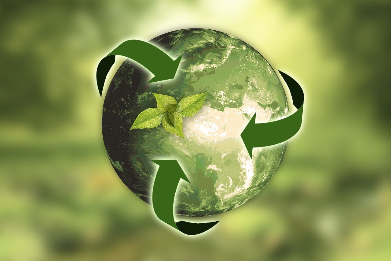 Sustainability pic: green earth circled by green arrows