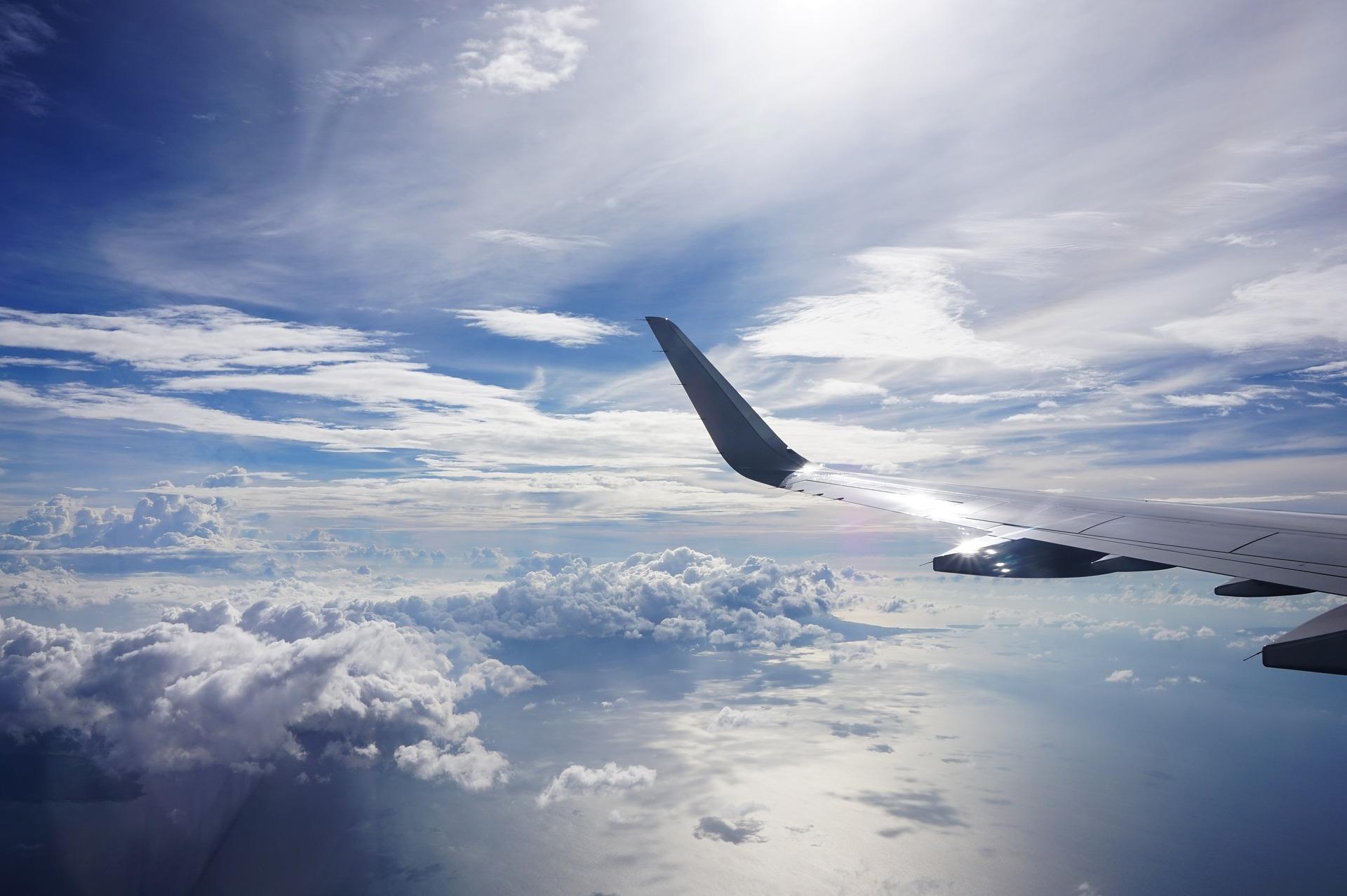 A view from airplane's window, airplanes' wing and clouds